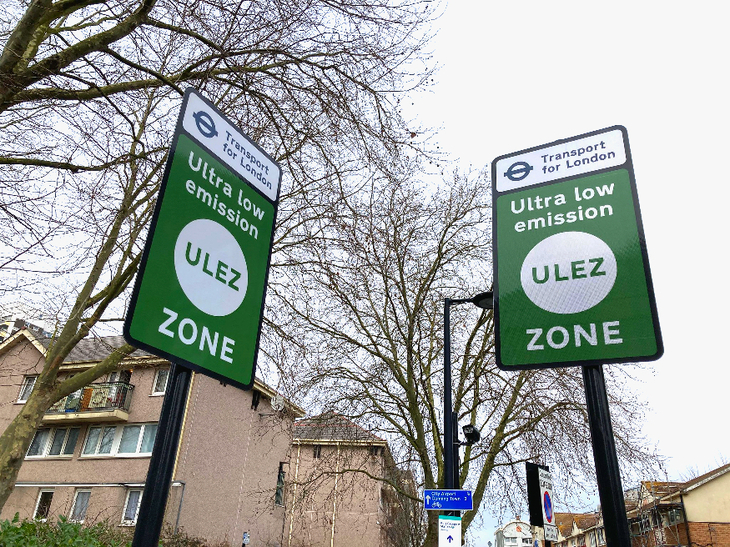 ULEZ expansion: two green and white TfL road signs, side by side, announcing the start of the ULEZ.