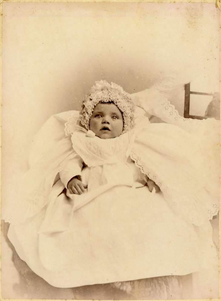 Sepia photo of a random Victorian baby in a bonnet