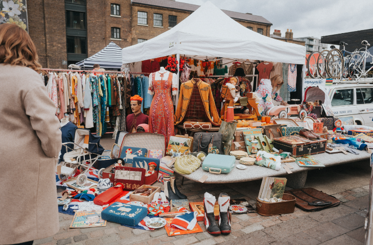 A stall laid out with vintage clothes and homewares at the Classic Car Boot Sale