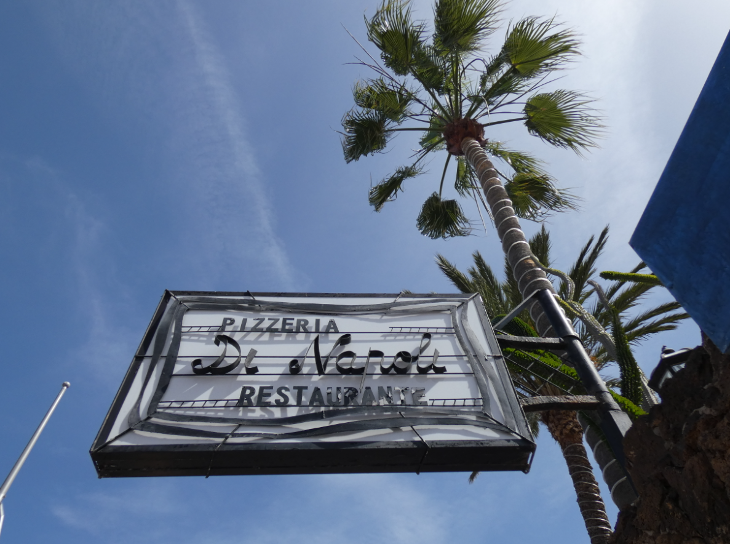 Corralejo in Fuerteventura: exterior of Di Napoli restaurant, and a palm tree