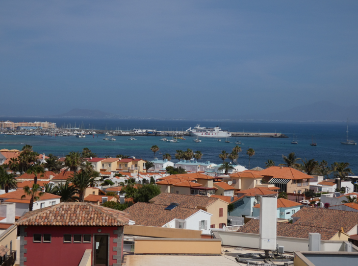 Corralejo in Fuerteventura: view towards Corralejo harbour and town from El Campanario bell tower, with a ferry docked in the harbour