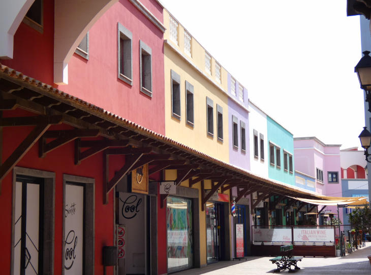 Corralejo in Fuerteventura: the different coloured shops at El Campanario shopping centre in Corralejo