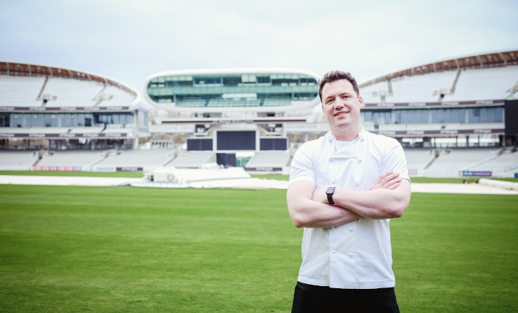 Autumn in London: Chef Tommy Banks standing in front of the pitch at Lord's in his chef whites