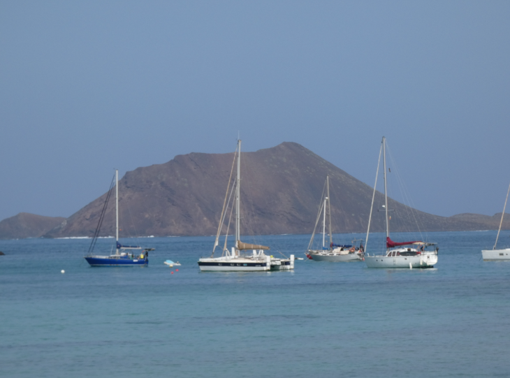 Corralejo in Fuerteventura: looking across the sea towards yachts, and the island of Los Lobos