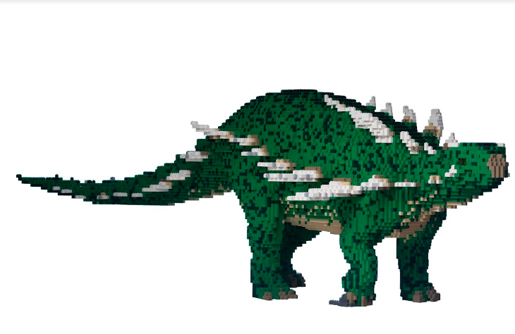 A green and white dinosaur model made of Lego.