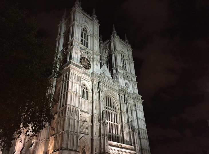 The exterior of Westminster Abbey at night.